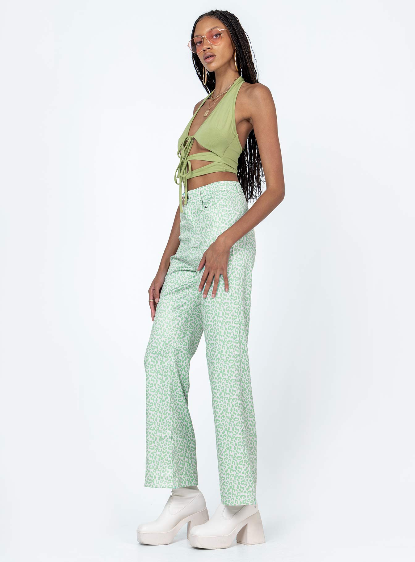Front view of model wearing  front Princess Polly  Ryllie Pants Green
