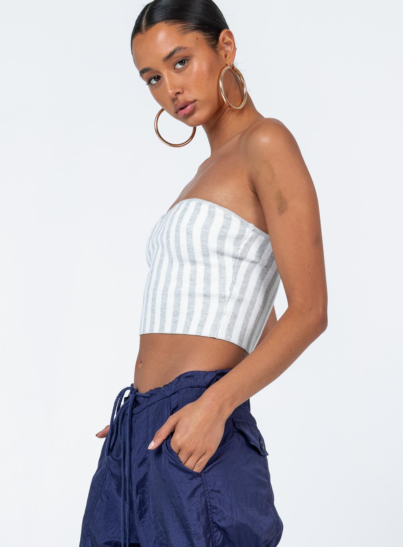 side view of model wearing Princess Polly Tarian Top Grey Stripe Sleeveless Sweetheart 