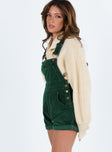 Khaki overalls Cord material  Adjustable shoulder straps  Button fastening at hips  Chest pocket 