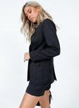 Black blazer Lapel collar  Padded shoulders  Button front fastening  Twin hip pockets 