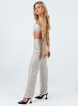 Matching set Sparkly material Crop top Adjustable shoulder straps Zip fastening at back Pants High rise Zip & clasp fastening  Subtle pleats at waist Straight leg