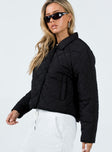 Cropped jacket Quilted material Pointed collar Press button fastening Twin hip pockets Non-stretch