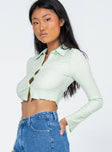 side view of model wearing Princess Polly Anson Long Sleeve Top Green 