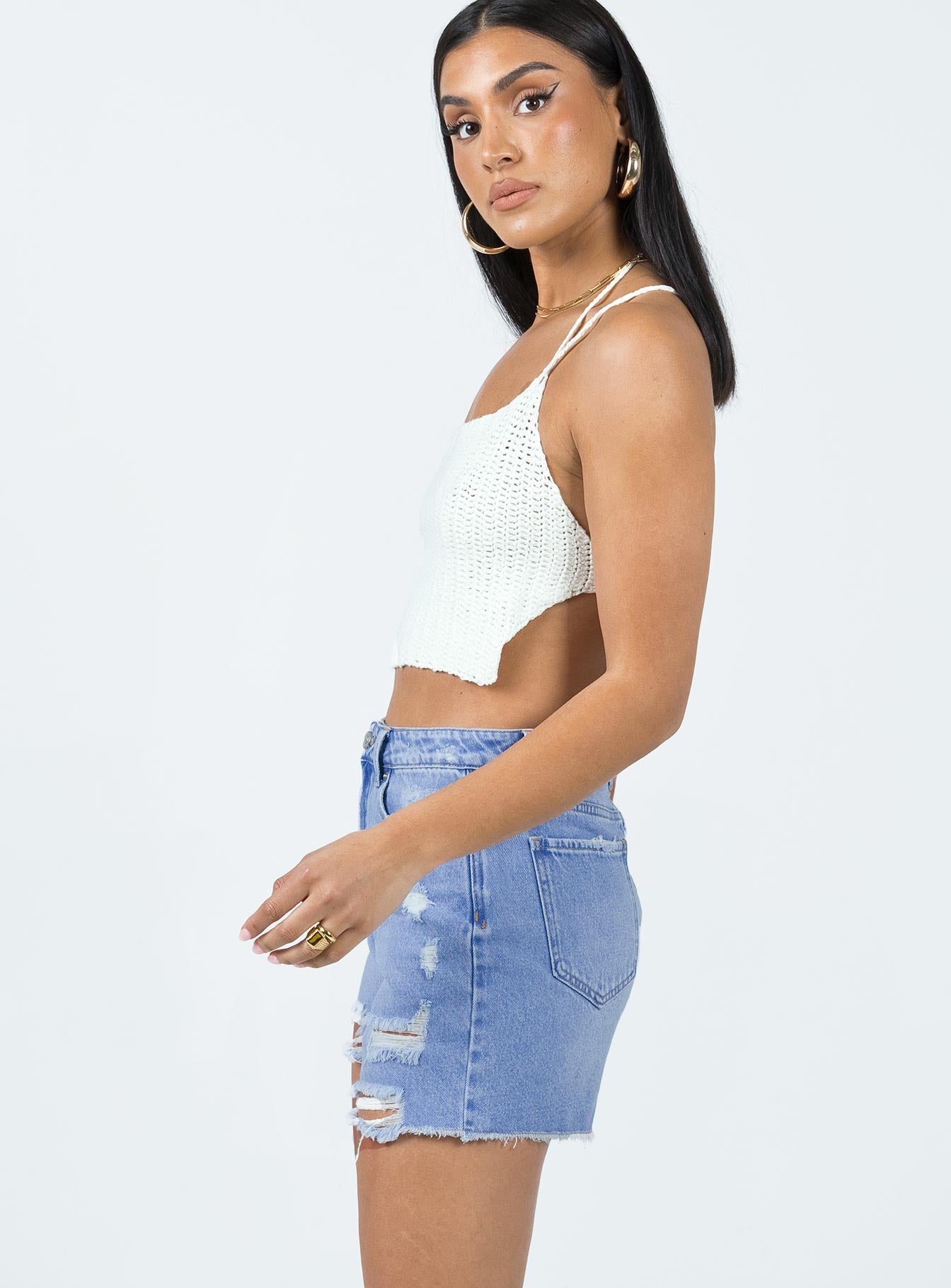 Denim shorts Mid wash denim High waisted design Belt looped waist Zip & button fastening Classic five-pocket design Distressed detail Raw edge hem
