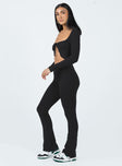 Matching set Soft knit material  Long sleeve top  Wide neckline  Tie fastening at bust  High waisted pants  Flared leg 