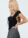 Corset top Puff sleeve Tie fastening at bust Hook & eye fastening at front Invisible zip fastening at side Curved hem