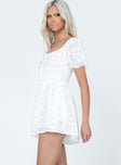 White romper Textured material  Elasticated puff sleeves  Shirred waist  Fixed tie at bust 