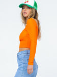 side view of model wearing Princess Polly Kinsey Long Sleeve Top Orange 