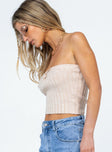 Strapless top  Slim fitting  66% acrylic 30% polyester 4% elastane  Soft knit material  Twisted bust 