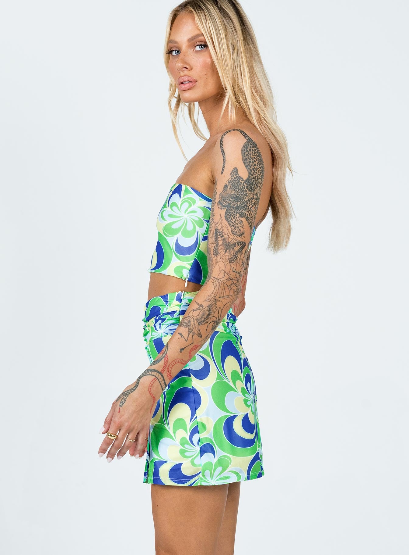   side view of model wearing Princess Polly Public Desire Mini Skirt Multi 