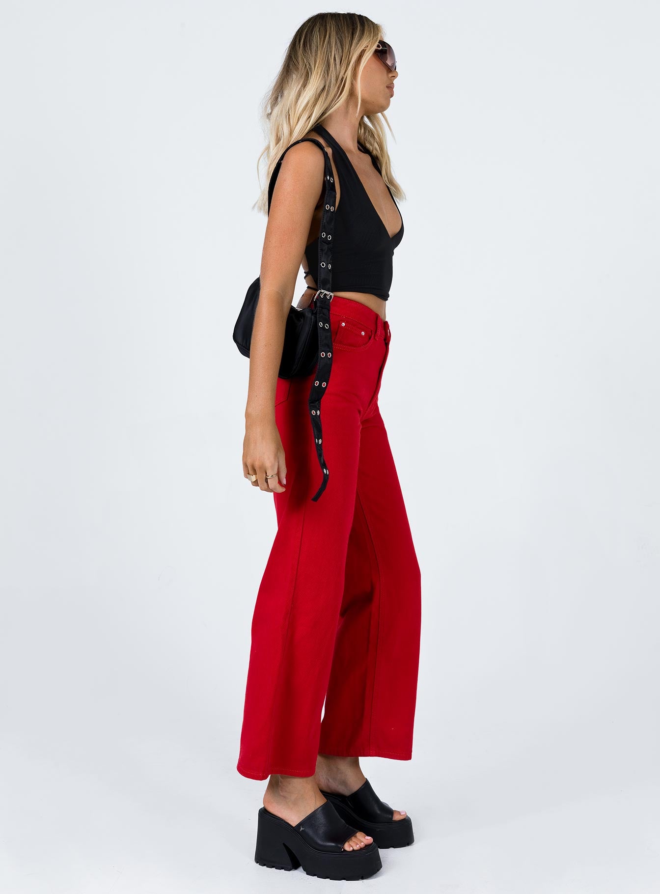 side view of model wearing Princess Polly Denver Denim Jeans Red Mid Rise 