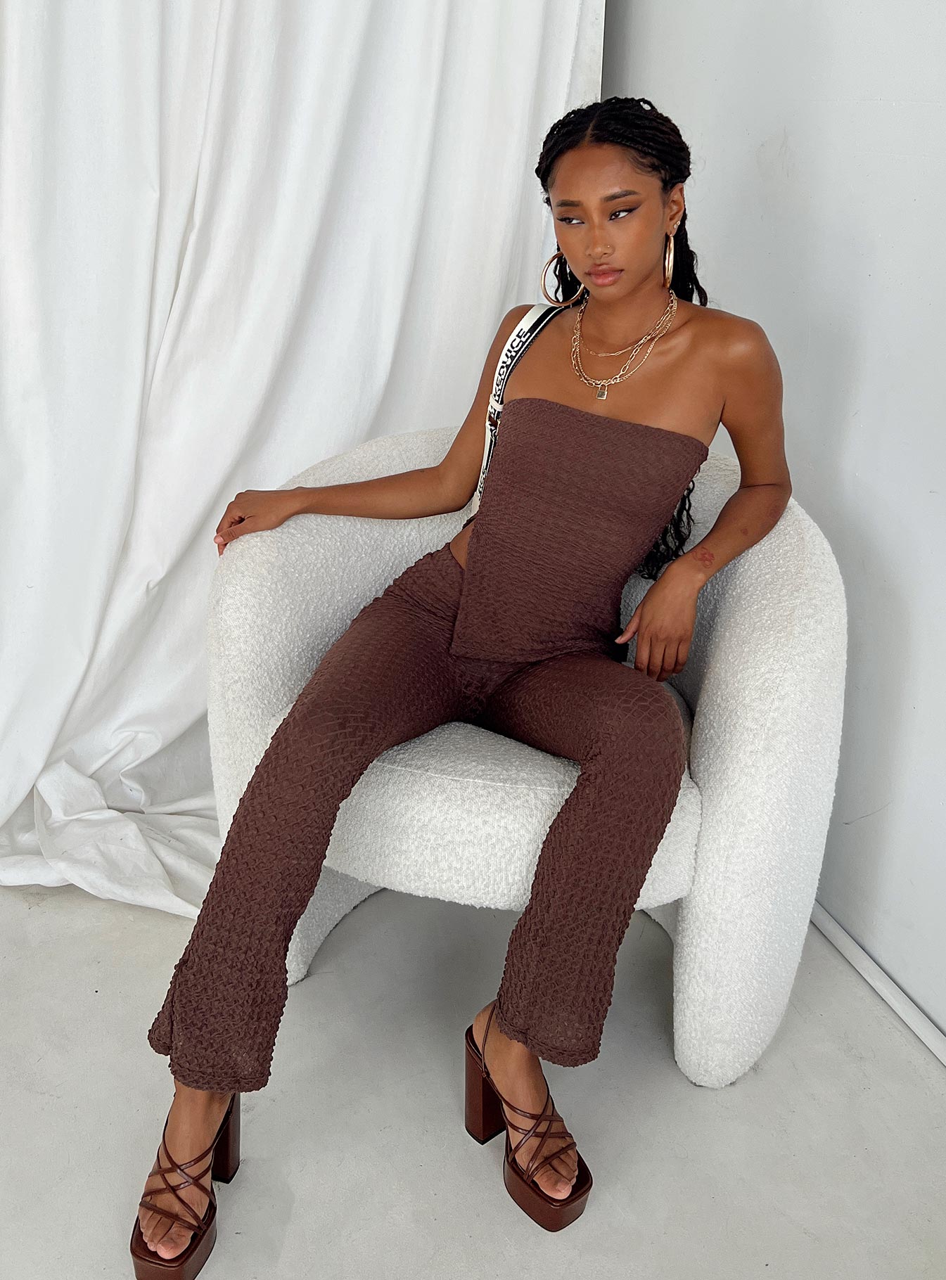 Matching set Popcorn material Strapless top Inner silicone strip at bust Side slit detail Invisible zip fastening at side Pants Elasticated waistband