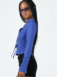 Long sleeve top Classic collar  Plunging neckline  Double tie front fastening  Split cuffs 