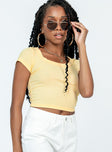 Yellow top Ribbed material  Scooped neckline  Cap sleeves 