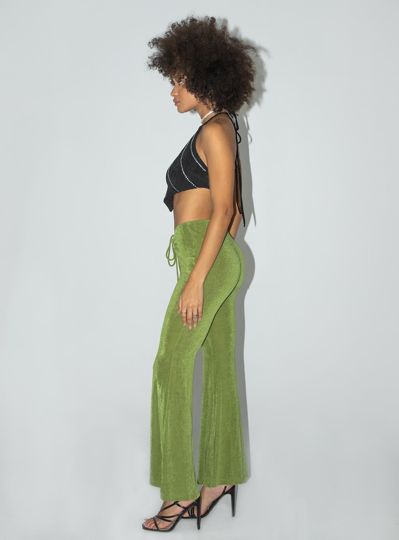 side view of model wearing Princess Polly Abi Pants Green 