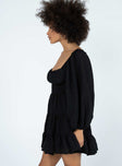 side view of model wearing Princess Polly Danny Long Sleeve Mini Dress Black Sweetheart Neckline 