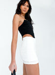   side view of model wearing Princess Polly Nowell Mini Skirt White Mini Skirts 