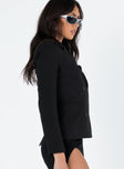 Black blazer Lapel collar  Double breasted design  Faux front pockets  Shoulder pads  Slit at back 