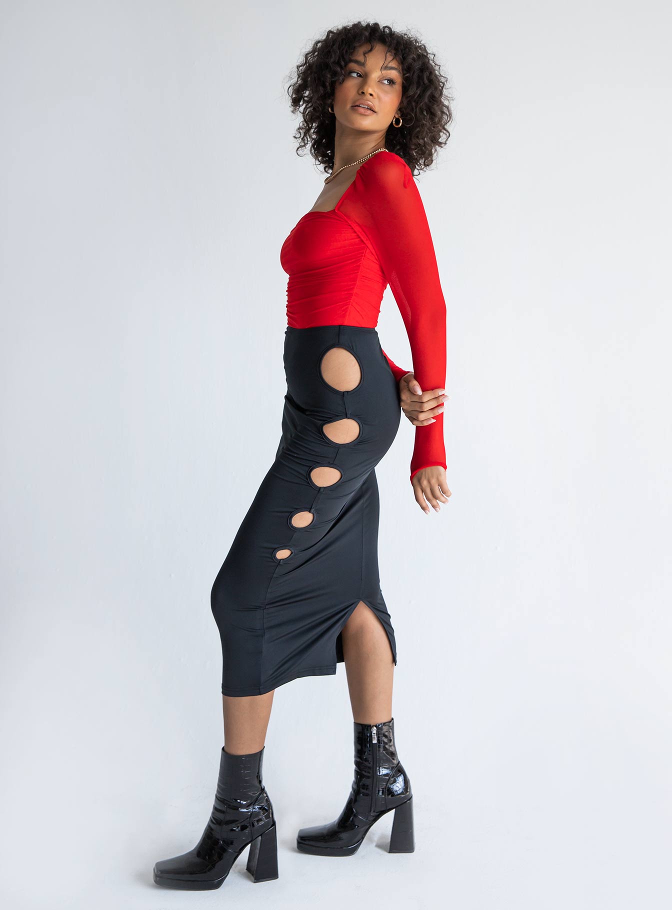   side view of model wearing Princess Polly Alice Keyhole Maxi Skirt Black 