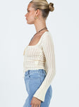 Long sleeve top Knit material Scoop neck Tie detail at bust Flared sleeve Good Stretch Unlined 