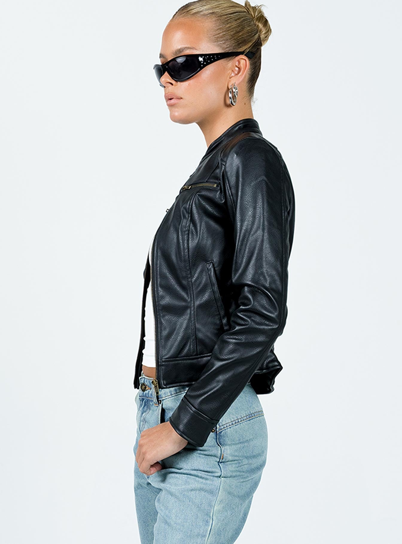 Leather jacket Faux leather material Gold-toned hardware High neck Zip fastening at front