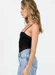 side view of model wearing Princess Polly Baumea Bodysuit Black Sleeveless Square Neck 