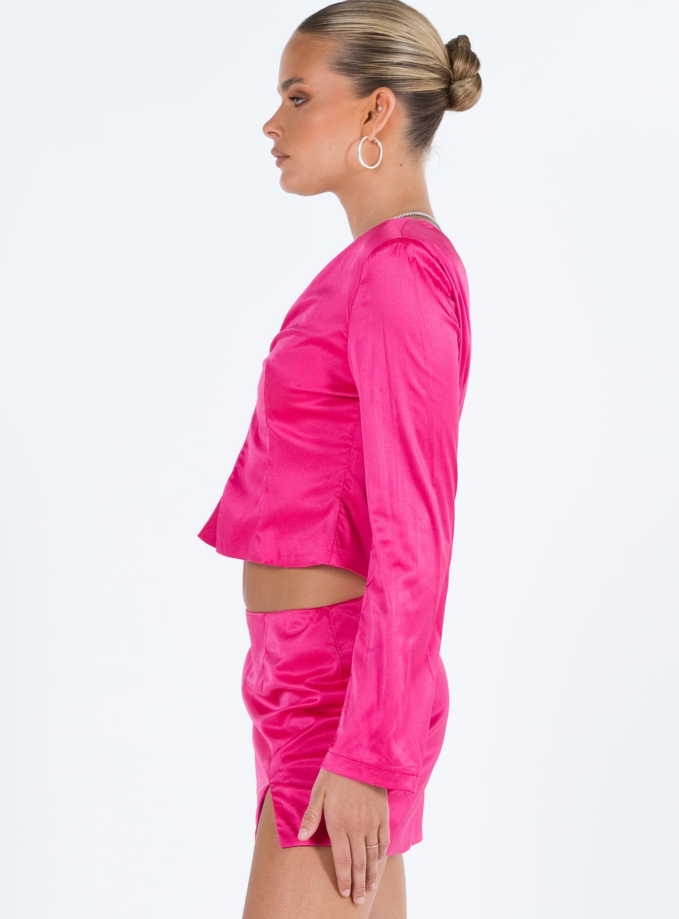 Pink matching set Silky material Long sleeve top V neckline Hook and eye fastening at bust Split hem Mini skirt Invisible zip fastening at back