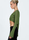 Long sleeve top Knit material Round neck Tie fastening at front Flared sleeves Good stretch Unlined 