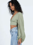 Long sleeve top V-neckline Button fastening at front Shirred panel at back Elasticated cuff