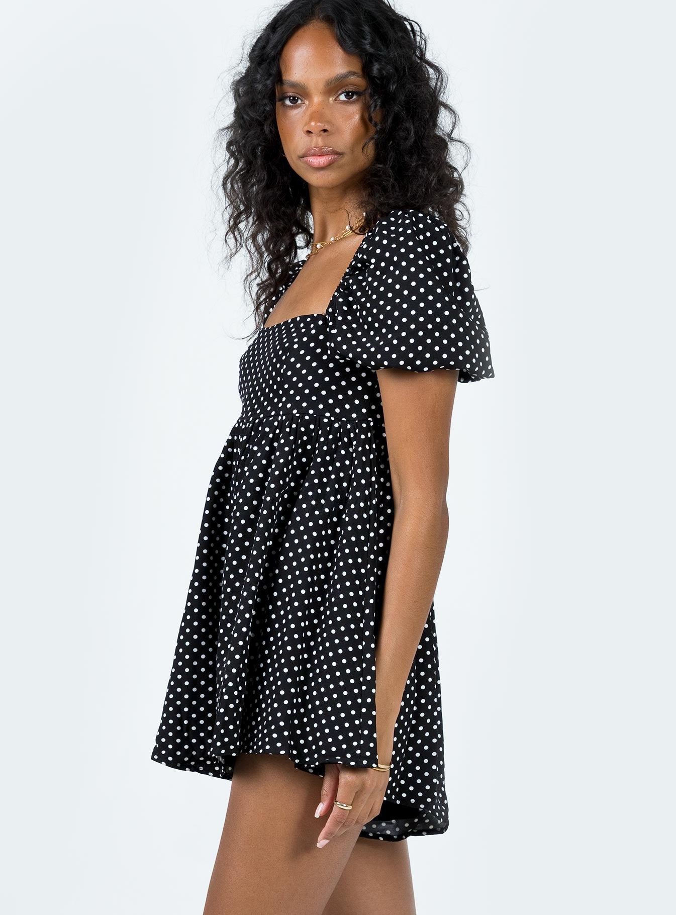 Romper Polka dot print Square neckline  Elasticated puff sleeves Shirred back panel Invisible zip fastening at back  Relaxed leg 