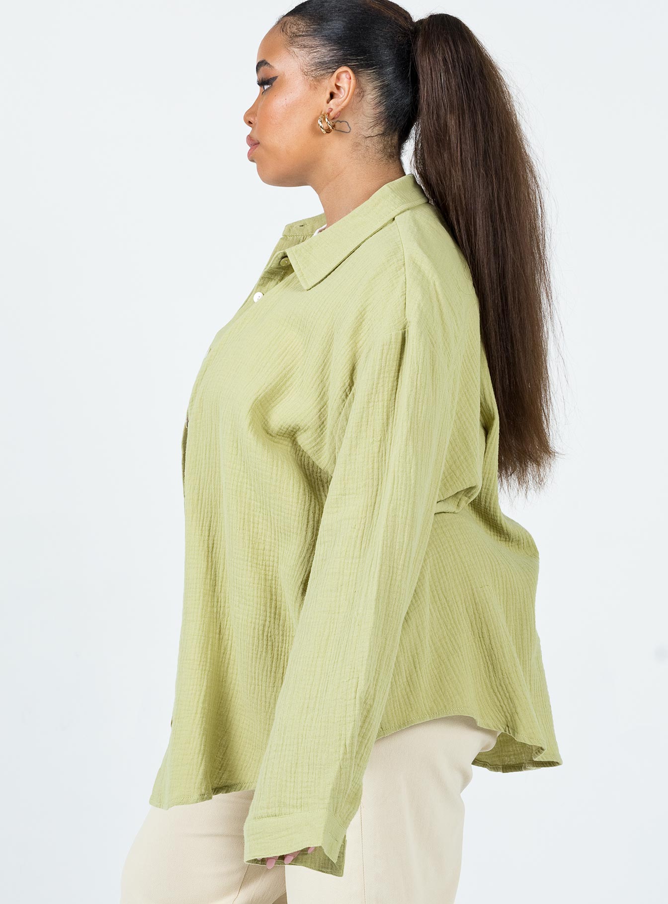 side view of model wearing Princess Polly Mahalia Shirt Green Curve 