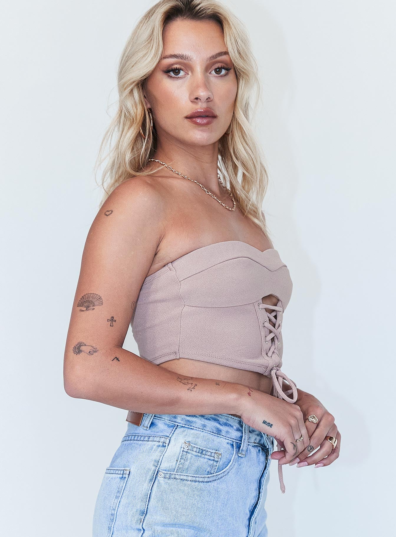 side view of model wearing Princess Polly Kerlin Top Brown 