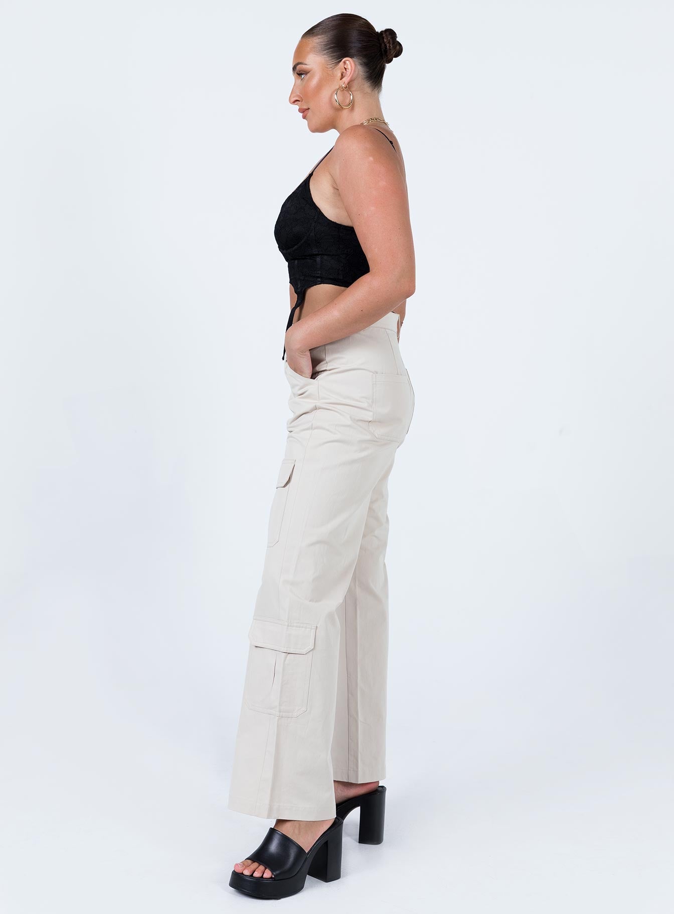 side view of model wearing Princess Polly Glenda Pants Beige High Waisted Pants 
