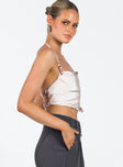 Champagne crop top Silky material Halter neck style Silver-toned buckle fastening Twin elasticated straps at back Pointed hem