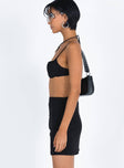 Black matching set Bralette style top Adjustable shoulder straps Wired cups Padded cups Elasticated band  Mini skirt Invisible zip fastening at side