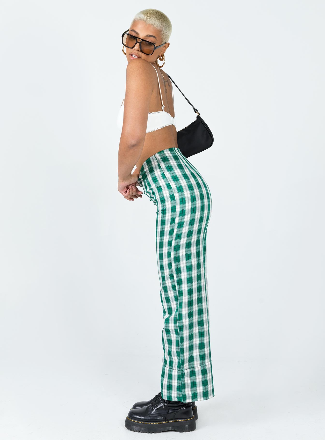 side view of model wearing Princess Polly Euros Pants Green Tartan 