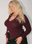 Maroon long sleeve top Ribbed knit material Low cut neckline Split front hem Good stretch Unlined