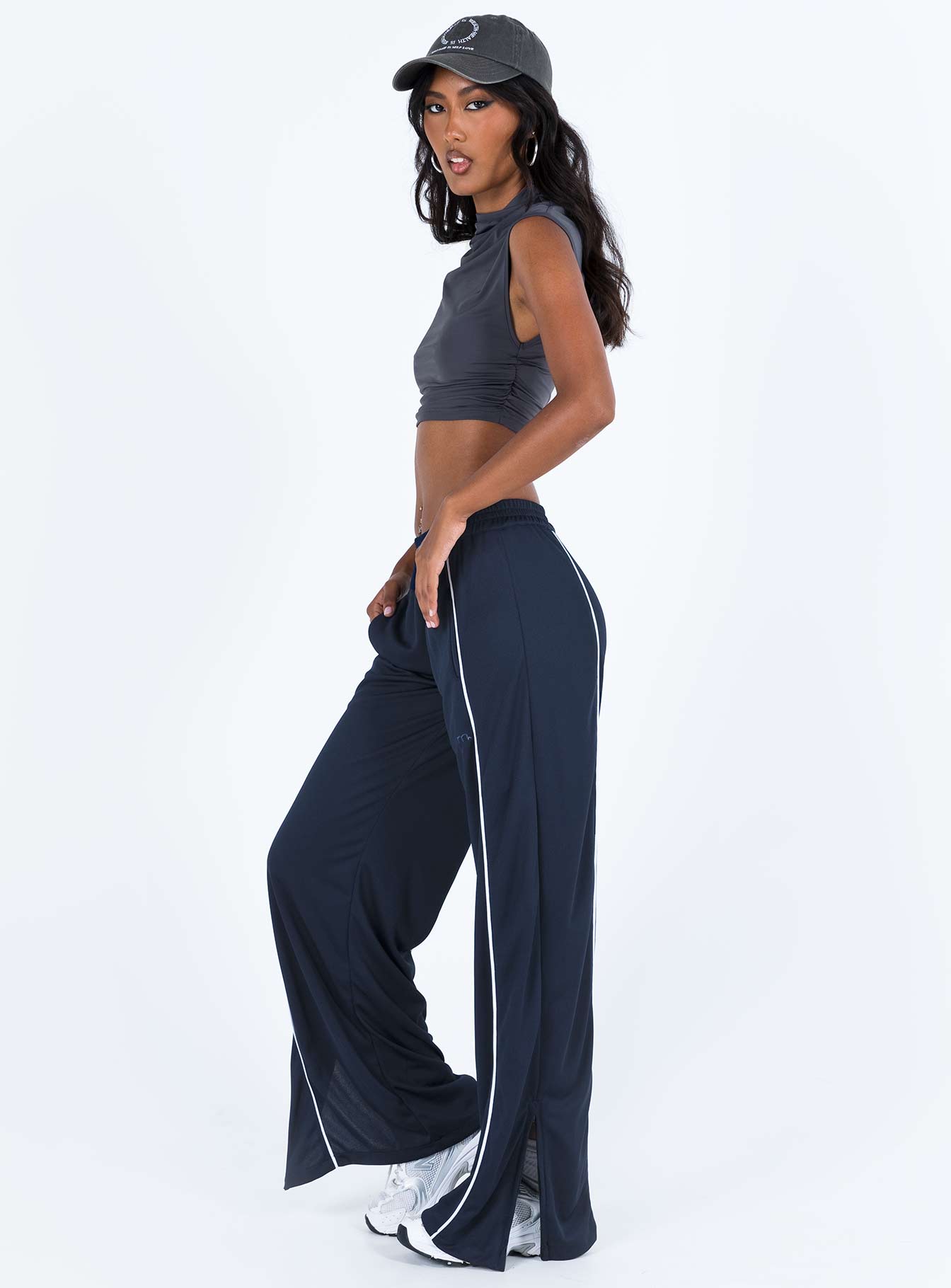 Front view of model wearing  front Princess Polly High Waisted Pants  Motel Shobi Jogger Navy