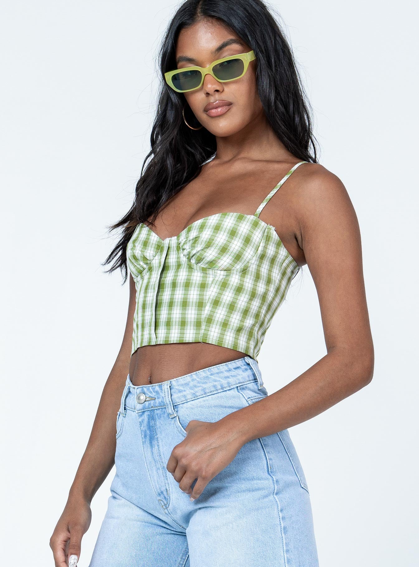 side view of model wearing Princess Polly Tuscan Top Green Sleeveless Sweetheart 