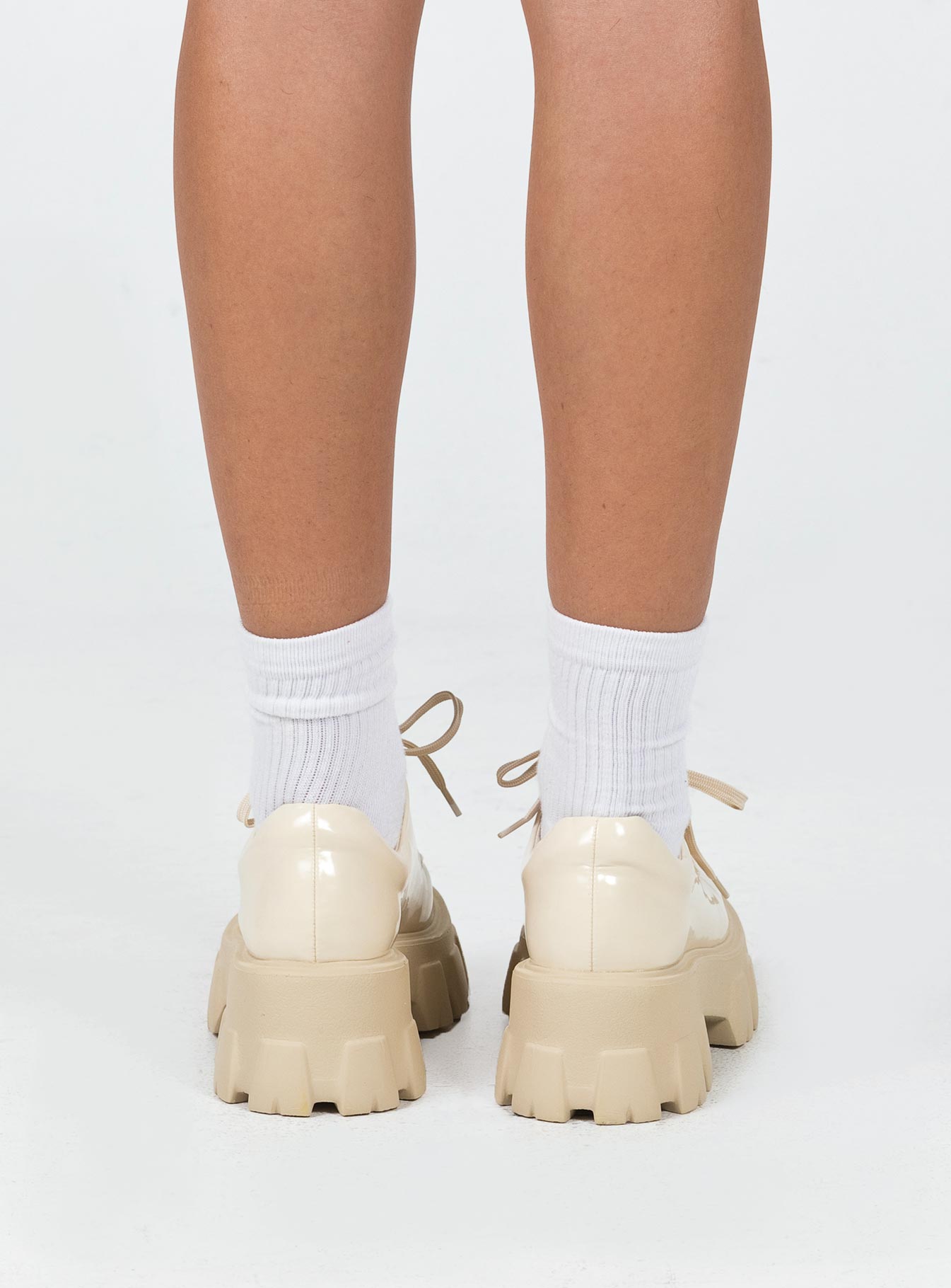 Platform shoes Faux leather Lace up fastening Chunky tread Padded ankle 