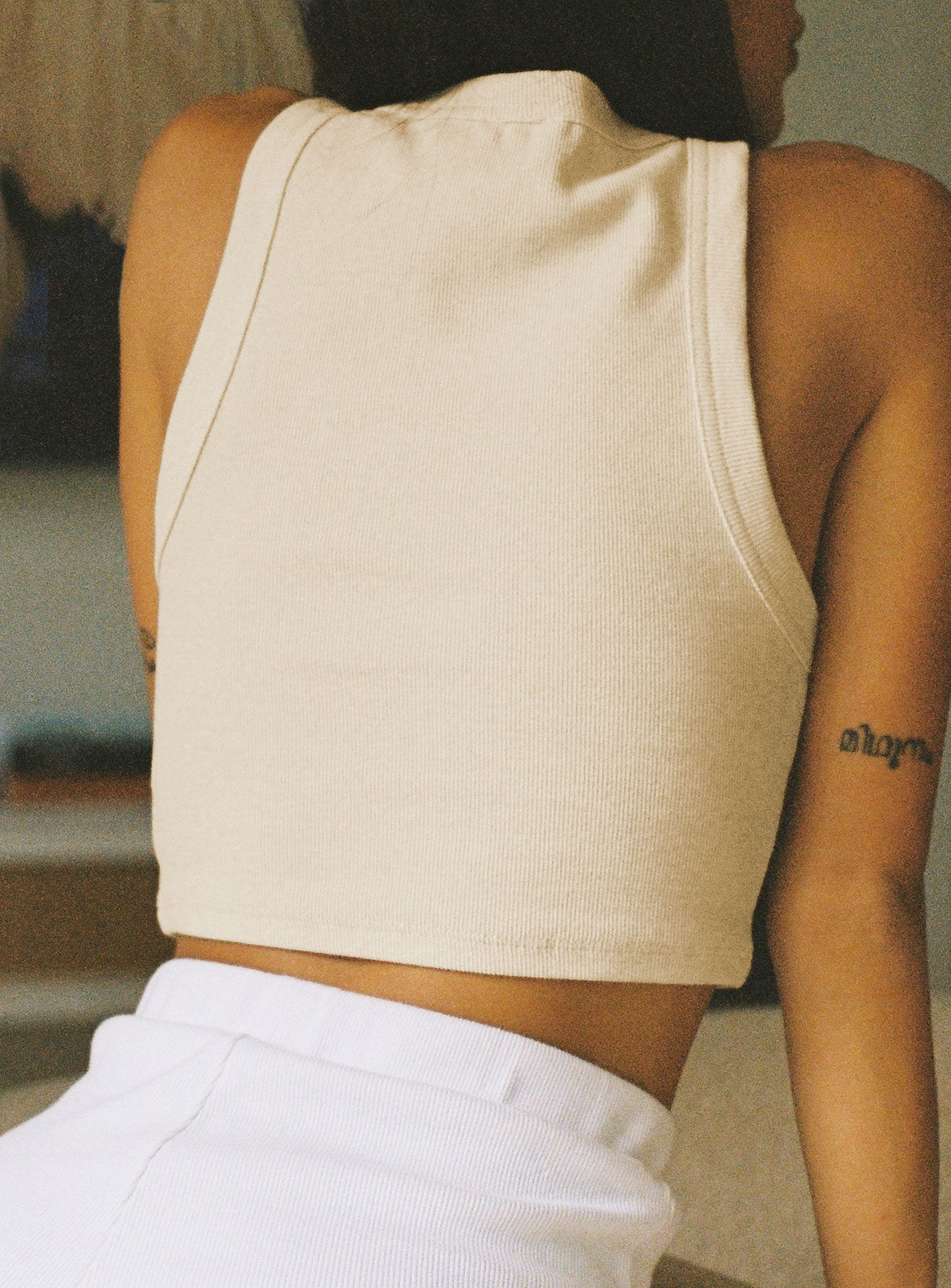 back view of model wearing Princess Polly Classic Tank Top Cream 