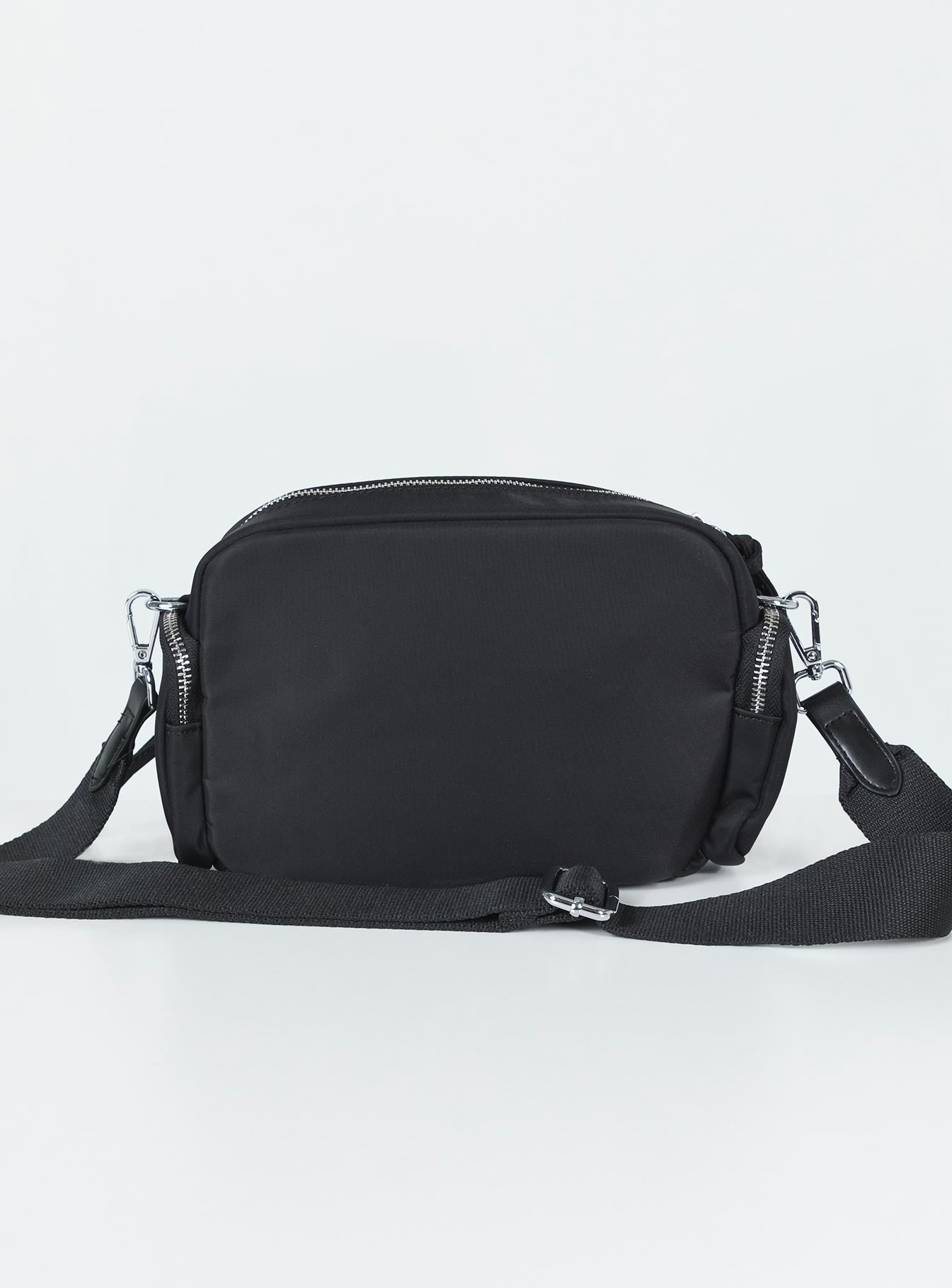 Crossbody bag Nylon material Silver-toned hardware Zip fastening Front & side pocket detailing Adjustable & removable crossbody strap Inner pocket zip fastening Flat base with feet studs