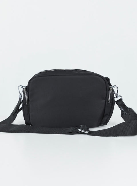 Crossbody bag Nylon material Silver-toned hardware Zip fastening Front & side pocket detailing Adjustable & removable crossbody strap Inner pocket zip fastening Flat base with feet studs