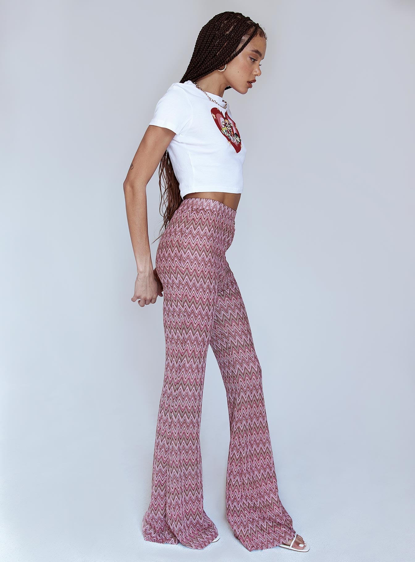 side view of model wearing Princess Polly Karmen Chevron Knit Flare Pants Pink 