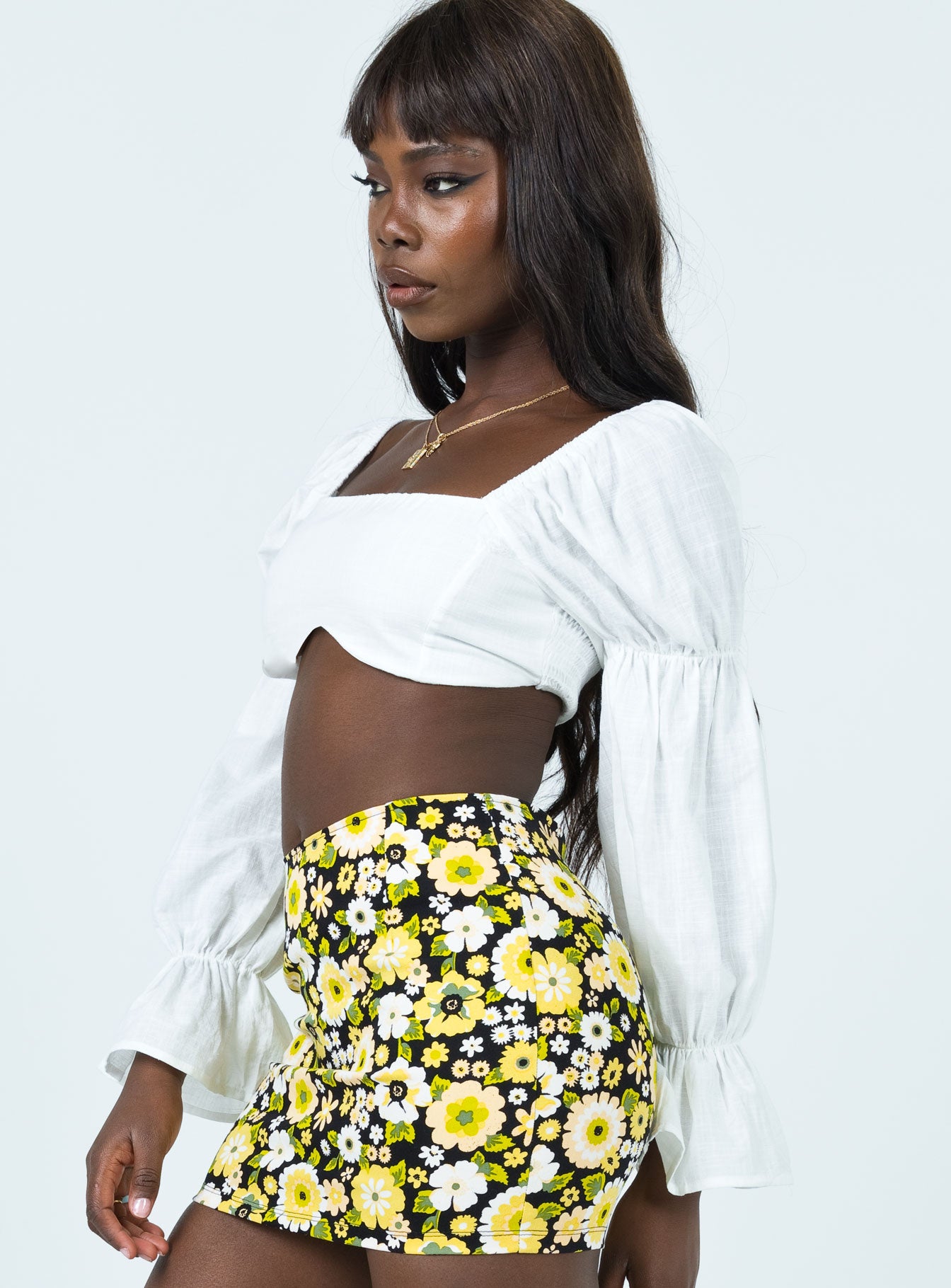 side view of model wearing Princess Polly Nolan Long Sleeve Top White 