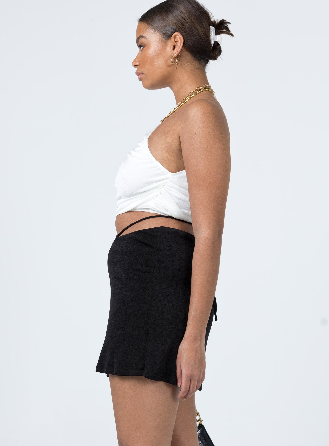   side view of model wearing Princess Polly Maisie Mini Skirt Black 