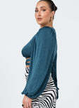 side view of model wearing Princess Polly Adi Long Sleeve Top Blue 