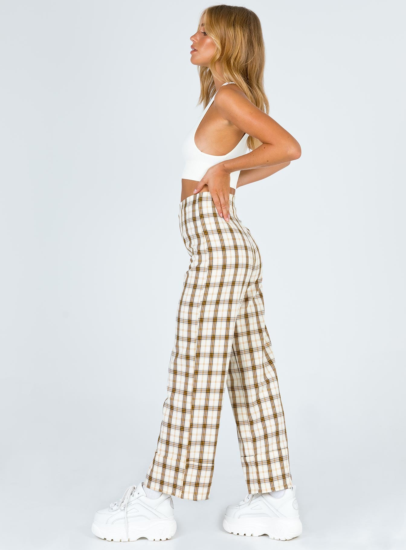 side view of model wearing Princess Polly Euros Pants Yellow Check 