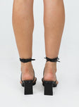 Heels Thin strappy upper  Ankle wrap tie fastening  Platform base  Block heel 