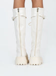 Boots Faux leather material  Zip fastening at back  Lace up front  Buckle strap at top  Platform base  Treaded sole 